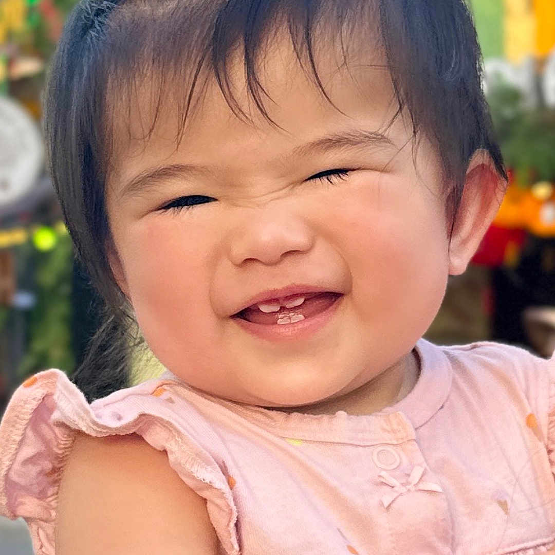 Celina is registered to the contest to win money with this photo: baby, babylaughing, blackhair, bodypart, clothing, dress, face, frown, hair, happy, head, laughing, mouth, person, photography, portrait, sad, shoulder, smile, teeth