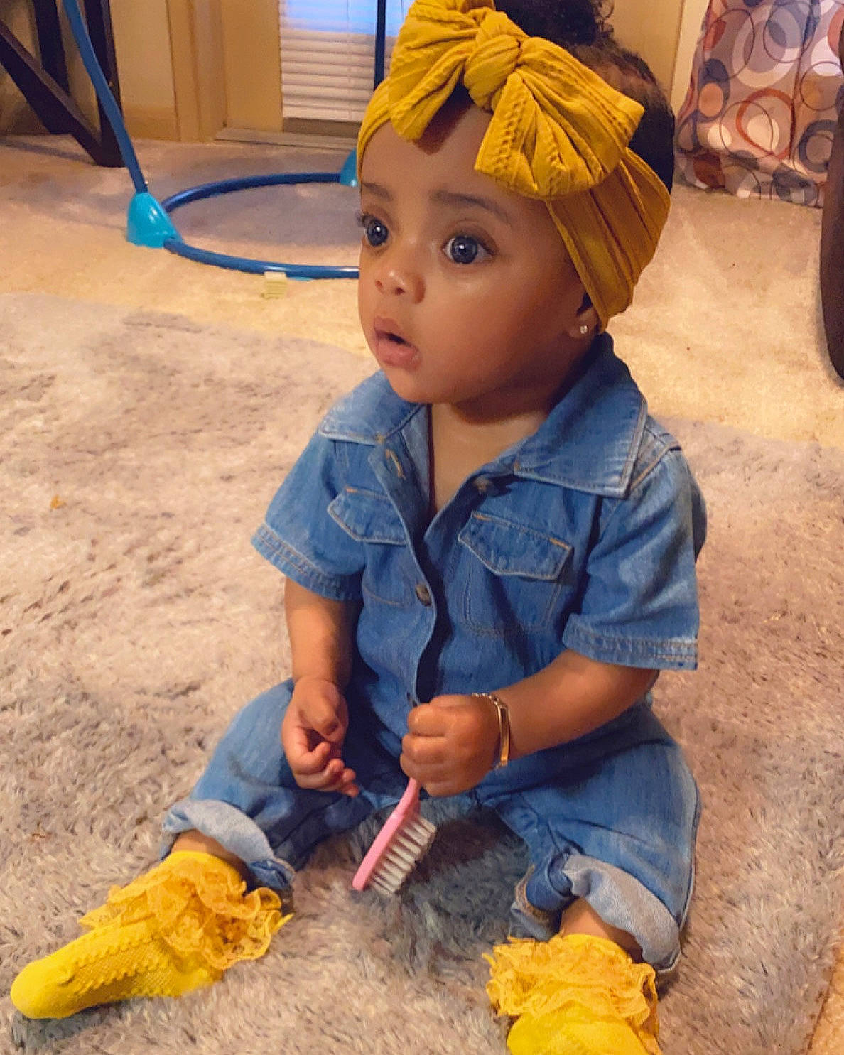 Aubri joined the competition — help win amazing prizes! blue, child, concrete, construction_worker, denim, electric_blue, fashion_accessory, floor, flooring, fun, headwear, helmet, human_leg, person, personal_protective_equipment, sitting, soil, surprise, temple, toddler