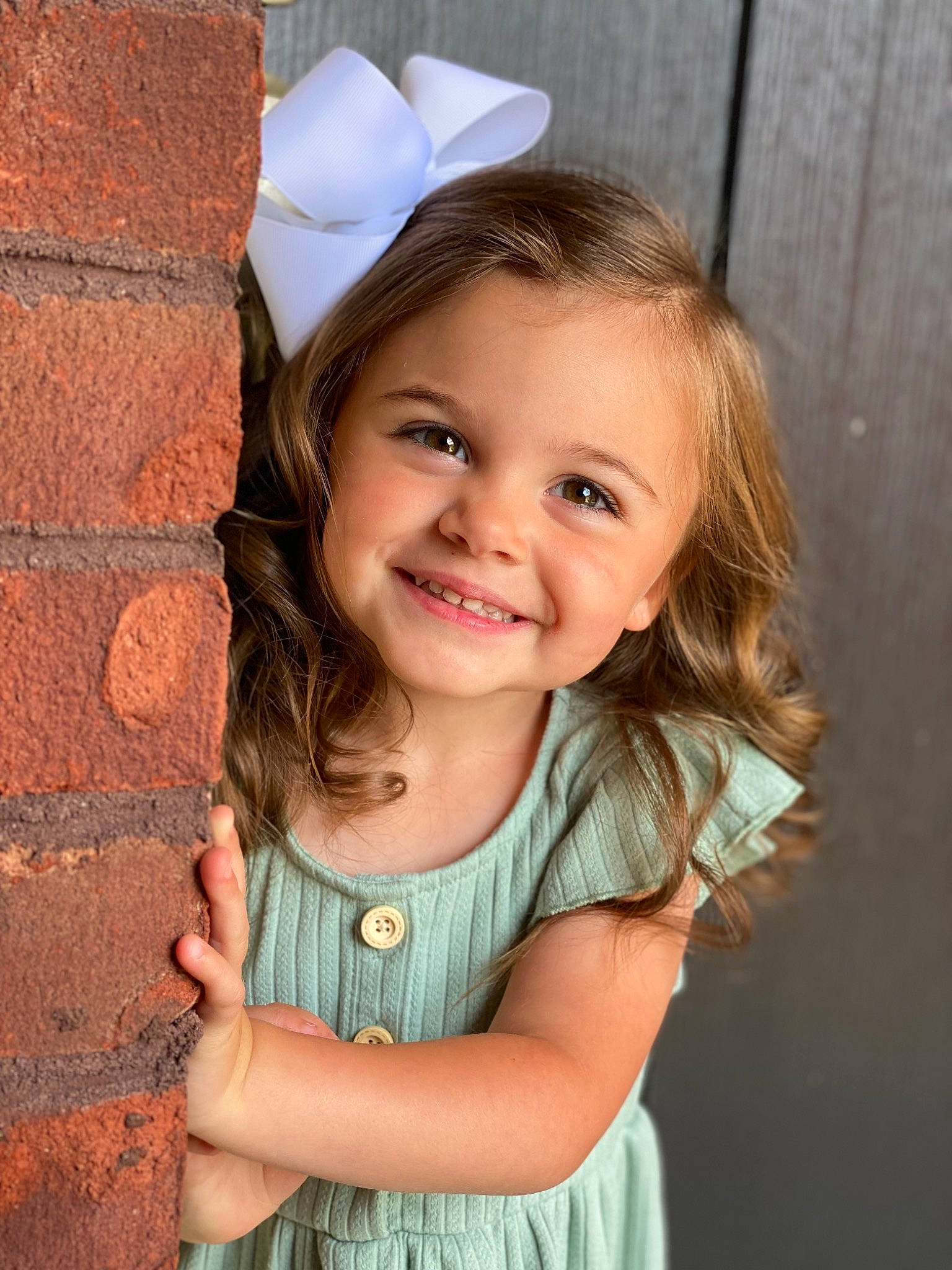 Teagan joined the competition — help win amazing prizes! brick, clothing, dress, eyelash, flash_photography, gesture, grass, hairstyle, happy, human_body, joy, lip, neck, organ, outerwear, people_in_nature, person, sleeve, smile, textile