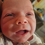 Weston is registered to the contest to win money with this photo: baby, newborn, face, closeup, infant, sleepy, mouth, nose, skin, onesie, clothing, cute, expression, person, head, indoors, human, babyclothes, soft, adorable