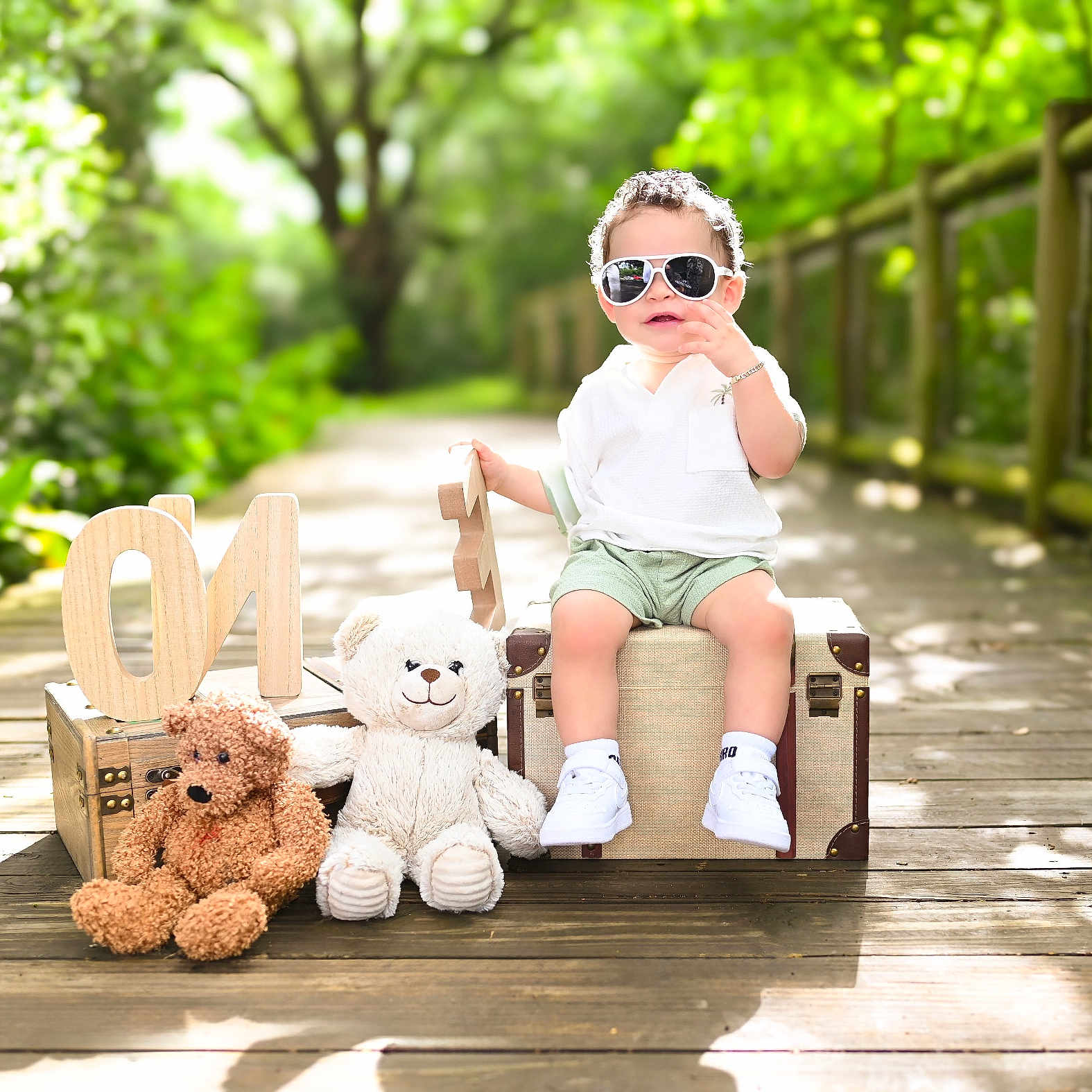 Mylan joined the competition — help win amazing prizes! casual_clothing, child, cute, greenery, one, outdoor, pathway, portrait, shoes, shorts, stuffed_animal, suitcase, summer, sunglasses, sunlight, teddy_bear, toddler, white_shirt, wooden_deck, wooden_letters