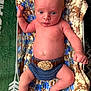 James joined the competition — help win amazing prizes! baby, infant, crocheted_blanket, knitted_clothing, diaper_cover, bare_chest, lying_down, indoors, curious_expression, skin, hand, foot, blanket, colorful, texture, newborn, cute, child, person, soft