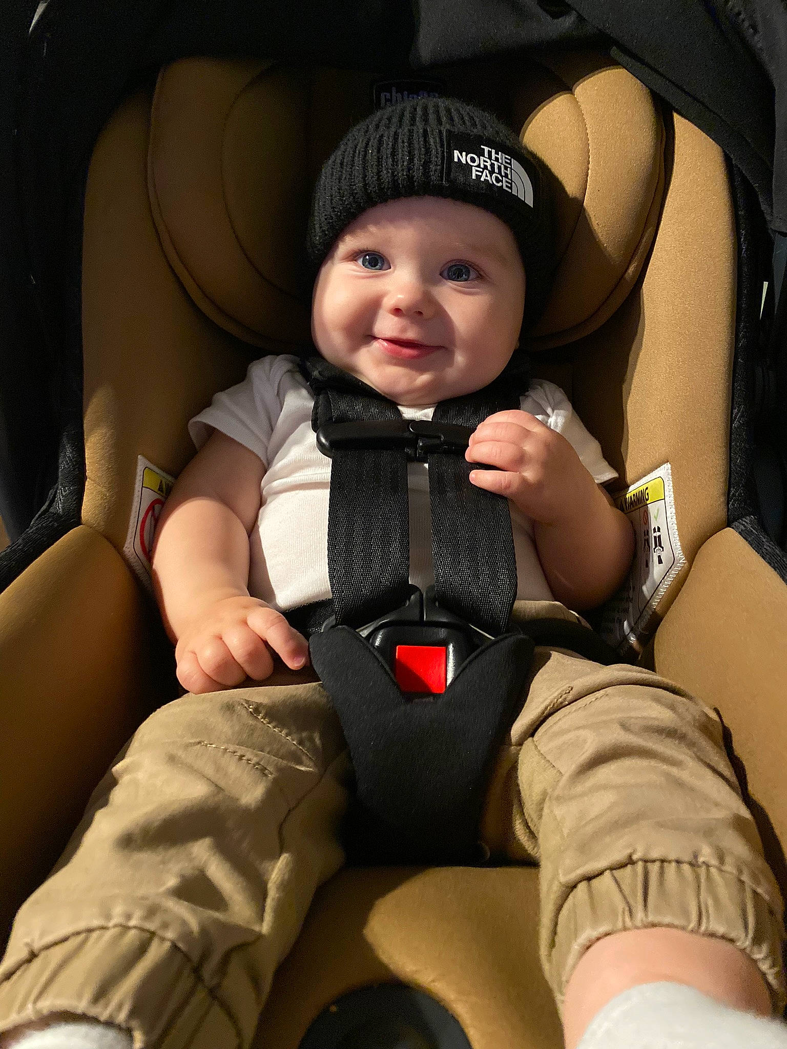 Bennett is registered to the contest to win money with this photo: auto_part, automotive_design, baby, baby_carriage, baby_products, baby_toddler_clothing, car_seat, child, comfort, finger, flash_photography, head_restraint, headwear, human_leg, joy, person, personal_protective_equipment, seat_belt, sitting, smile