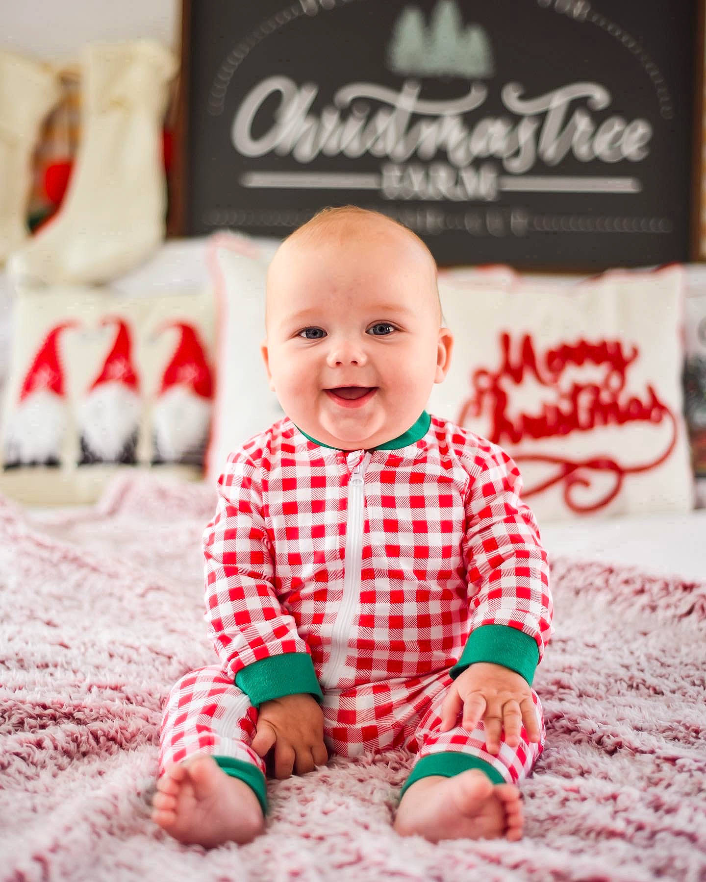 Bennett is registered to the contest to win money with this photo: baby, baby_toddler_clothing, carpet, child, design, flooring, foot, happy, joy, linens, logo, pattern, person, photograph, red, sitting, skin, sleeve, smile, t_shirt