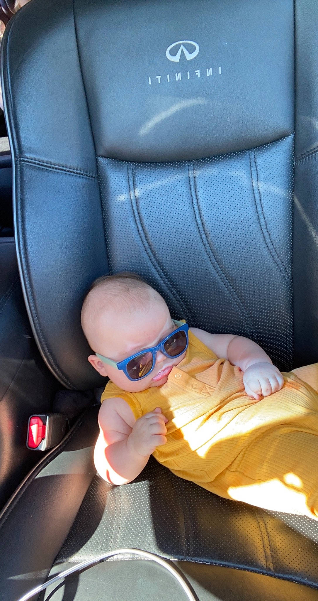Bennett is registered to the contest to win money with this photo: auto_part, automotive_design, baby, car_seat, car_seat_cover, child, comfort, eyewear, family_car, goggles, head_restraint, luxury_vehicle, motor_vehicle, person, personal_luxury_car, seat_belt, sunglasses, thumb, toddler, vehicle_door