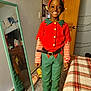 Alexander joined the competition — help win amazing prizes! child, smile, elf_costume, red, green, striped_sleeves, black_shoes, mirror, bed, plaid_bedspread, door, carpet, indoor, happy, costume, holiday, ear_accessory, belt, reflection, room