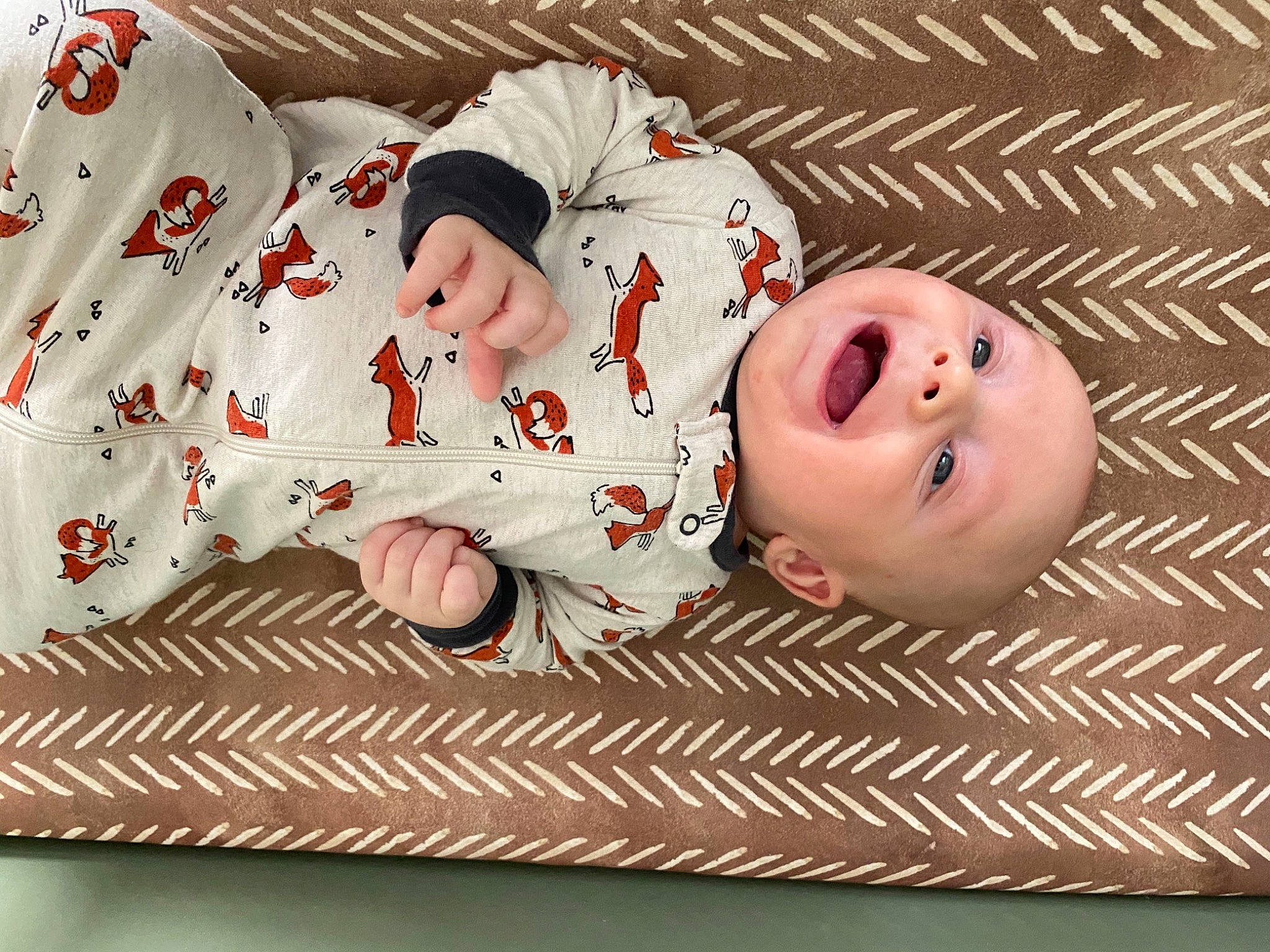 Keelan is registered to the contest to win money with this photo: baby, baby_toddler_clothing, carmine, child, comfort, flooring, grass, happy, pattern, person, portrait_photography, sleeve, smile, toddler, wood