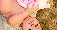 Davud joined the competition — help win amazing prizes! baby, bottle, care, carpet, child, cute, eyes, face, floor, hand, holding, indoor, infant, lotion, person, product, relaxing, skin, towel, young_child