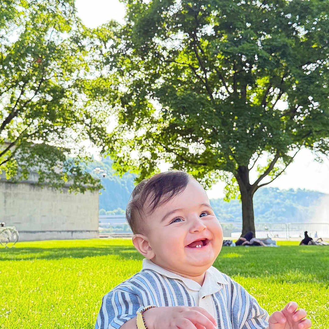 Davud joined the competition — help win amazing prizes! baby, child, smiling, grass, park, tree, sunlight, outdoor, nature, happy, clothing, sitting, bracelet, greenery, daylight, portrait, infant, casual, cute, relaxation