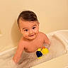 baby, bath, bubble_bath, rubber_duck, child, foam, water, bathtub, smile, happy, infant, skin, toy, playful, indoor, young_child, cute, cleaning, sitting, person