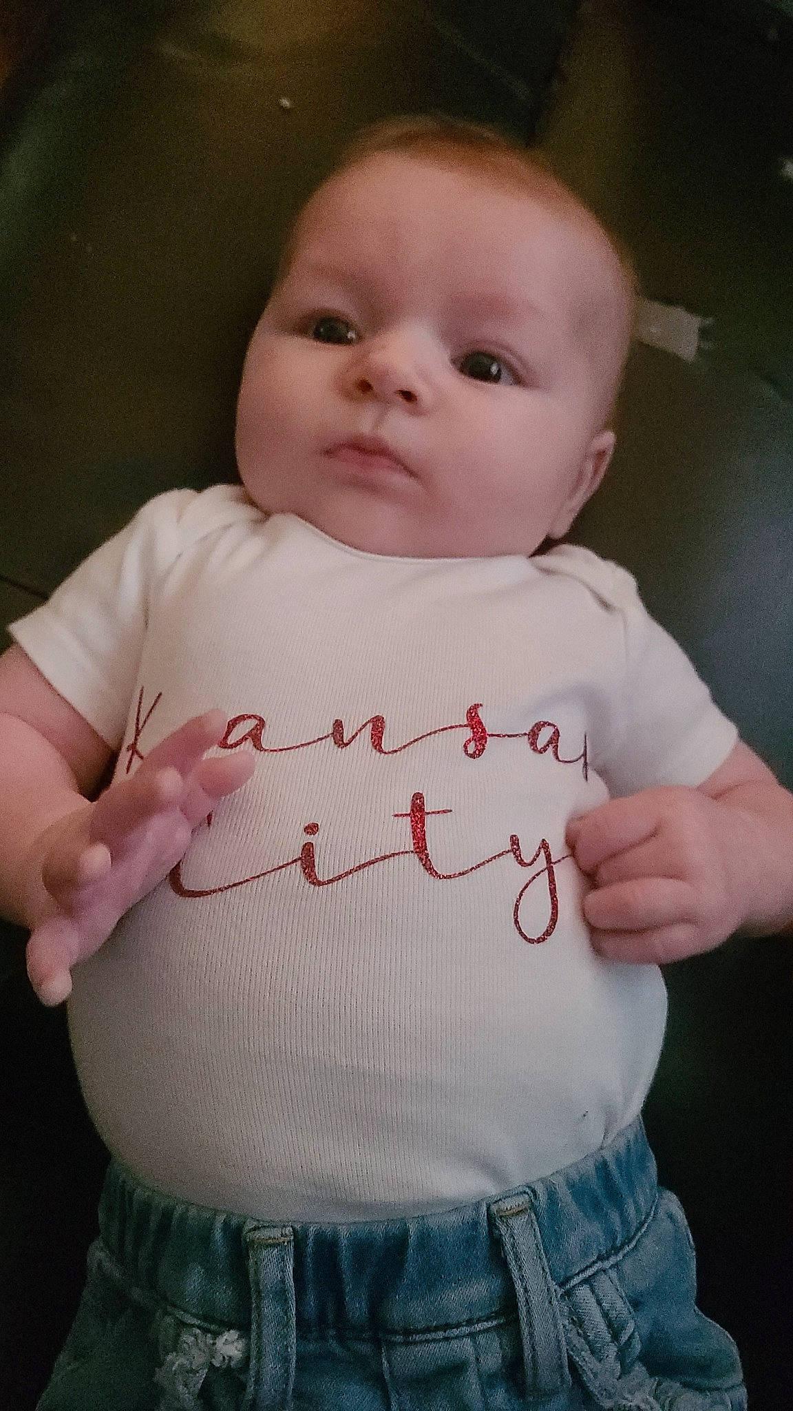 Athena is registered to the contest to win money with this photo: baby, baby_toddler_clothing, cheek, chest, child, clothing, finger, gesture, human_body, lip, organ, person, pink, product, skin, sleeve, standing, stomach, t_shirt, toddler