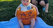 Phoenix joined the competition — help win amazing prizes! baby, child, sibling, sister, pumpkin, halloween, costume, outdoor, park, grass, blanket, portrait, smiling, sitting, crouching, family, autumn, sunlight, decorated_pumpkins, playful