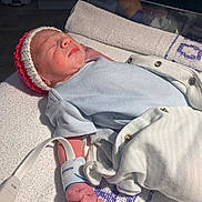 Ronnie joined the competition — help win amazing prizes! newborn, baby, infant, hospital, blanket, clothing, hat, medical_wristband, monitoring_device, sleeping, peaceful, healthcare, person, bed, towel, hospital_room, cute, small, skin, rest