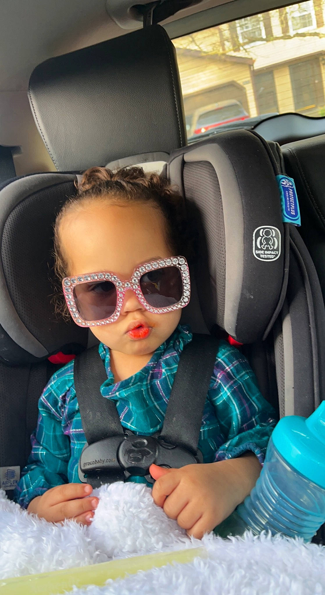 Reagan is registered to the contest to win money with this photo: auto_part, automotive_design, car_seat, car_seat_cover, comfort, eyewear, family_car, glasses, goggles, head_restraint, luxury_vehicle, motor_vehicle, person, personal_luxury_car, personal_protective_equipment, product, seat_belt, sunglasses, toddler, vehicle_door