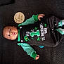 baby, infant, child, onesie, st_patricks_day, green_clothing, striped_sleeves, socks, wooden_month_marker, two_months, carpet, lying_down, portrait, cute, portrait_baby, face, hand, foot, pacifier, button