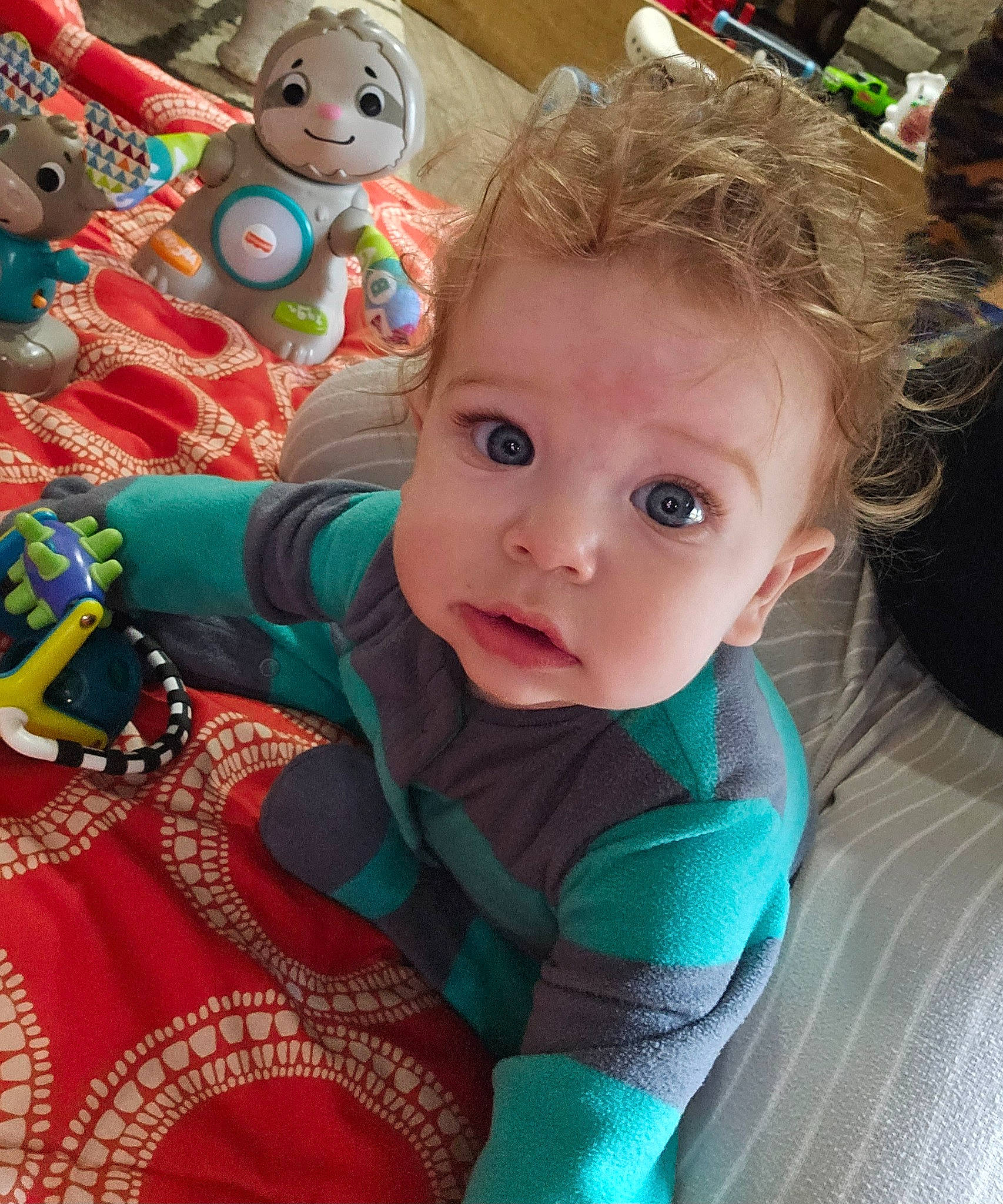 Colton is registered to the contest to win money with this photo: baby, baby_products, baby_toddler_clothing, cheek, child, event, eye, facial_expression, fun, grass, happy, holiday, iris, leisure, organ, person, sitting, skin, toddler, toy