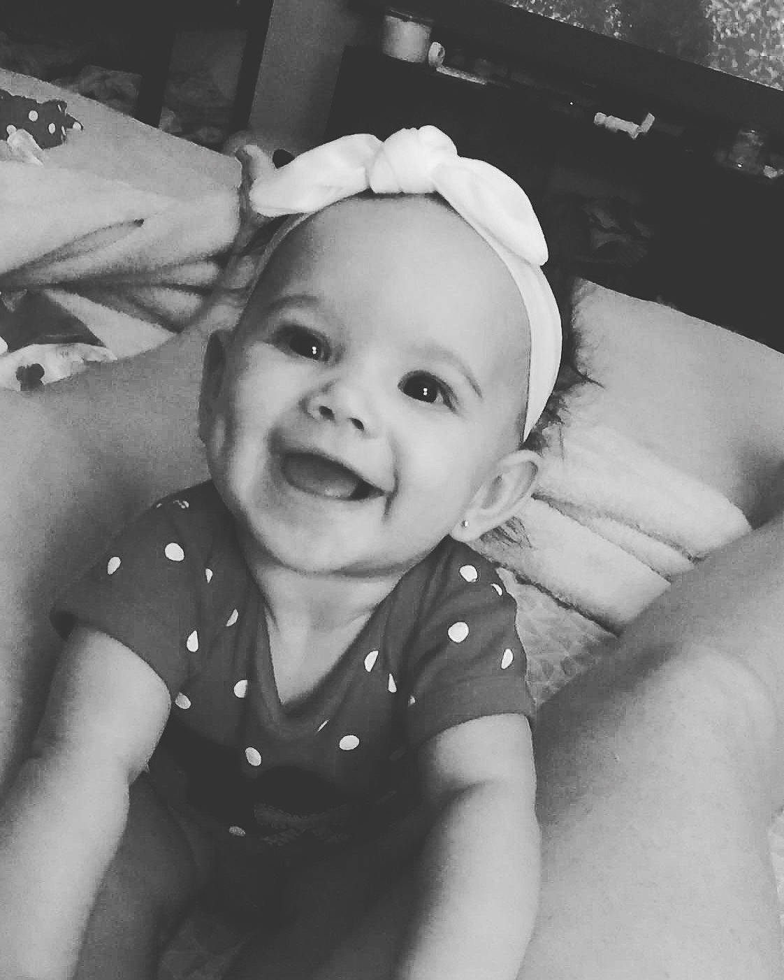 Kylynn is registered to the contest to win money with this photo: beauty, black, black_and_white, cheek, child, day, emotion, face, facial_expression, head, human_hair_color, infant, monochrome_photography, nose, person, photograph, skin, smile, snapshot, white