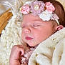 éléa participe au concours pour gagner de l'argent avec cette photo : baby, sleeping, blanket, flower_headband, basket, soft_texture, closeup, infant, peaceful, newborn, cute, face, skin, hand, pink, cozy, portrait, rest, head, child
