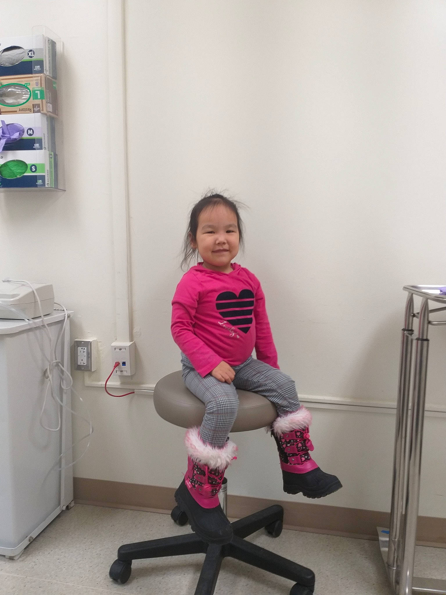 Michelle is registered to the contest to win money with this photo: chair, child, furniture, knee, leg, office_chair, person, pink, shoe, sitting, standing, stool, thigh, toddler