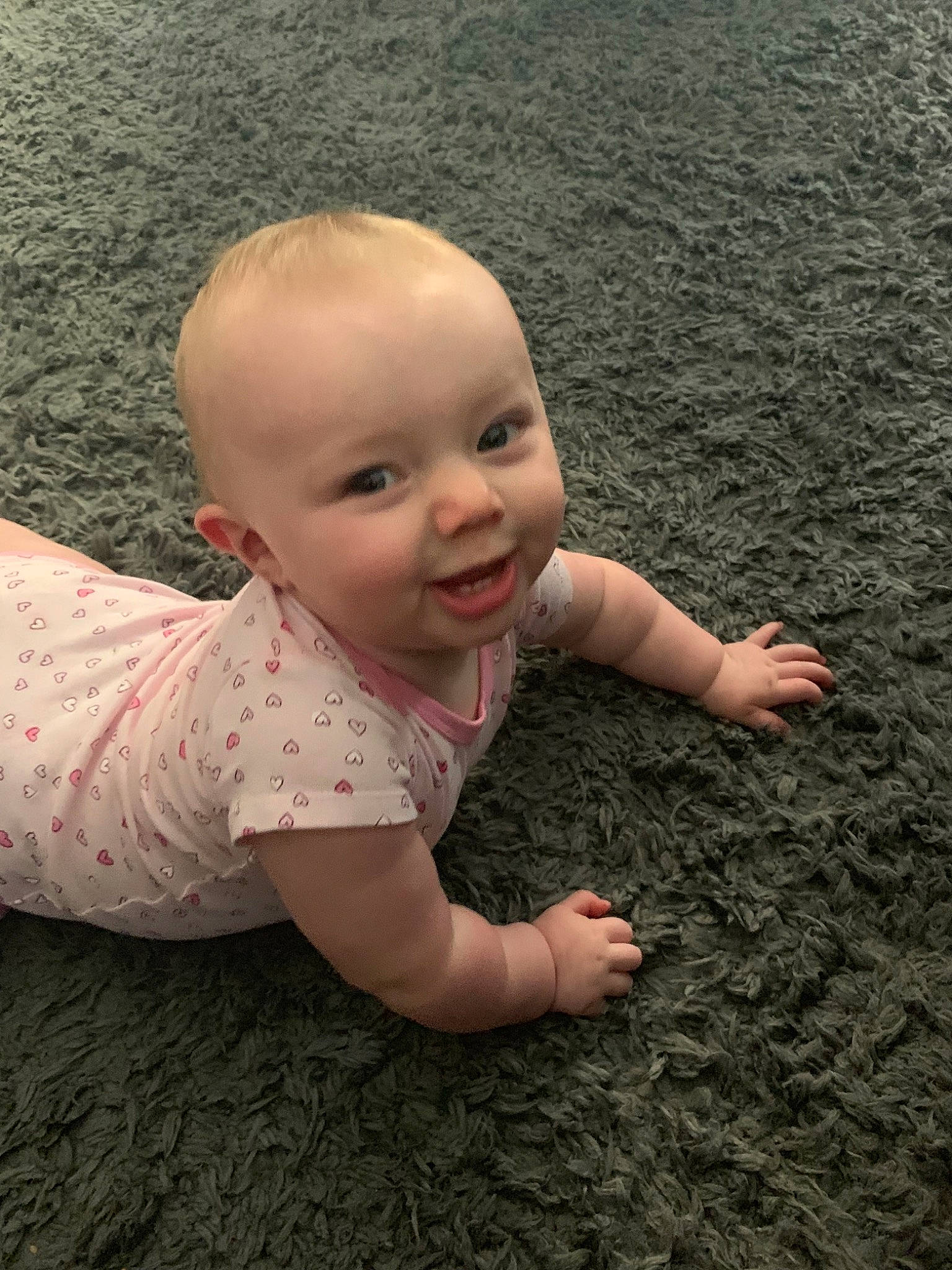 Ensley joined the competition — help win amazing prizes! baby, cheek, child, eye, finger, fun, grass, hand, head, lip, nose, person, photography, pink, skin, smile, toddler, vacation