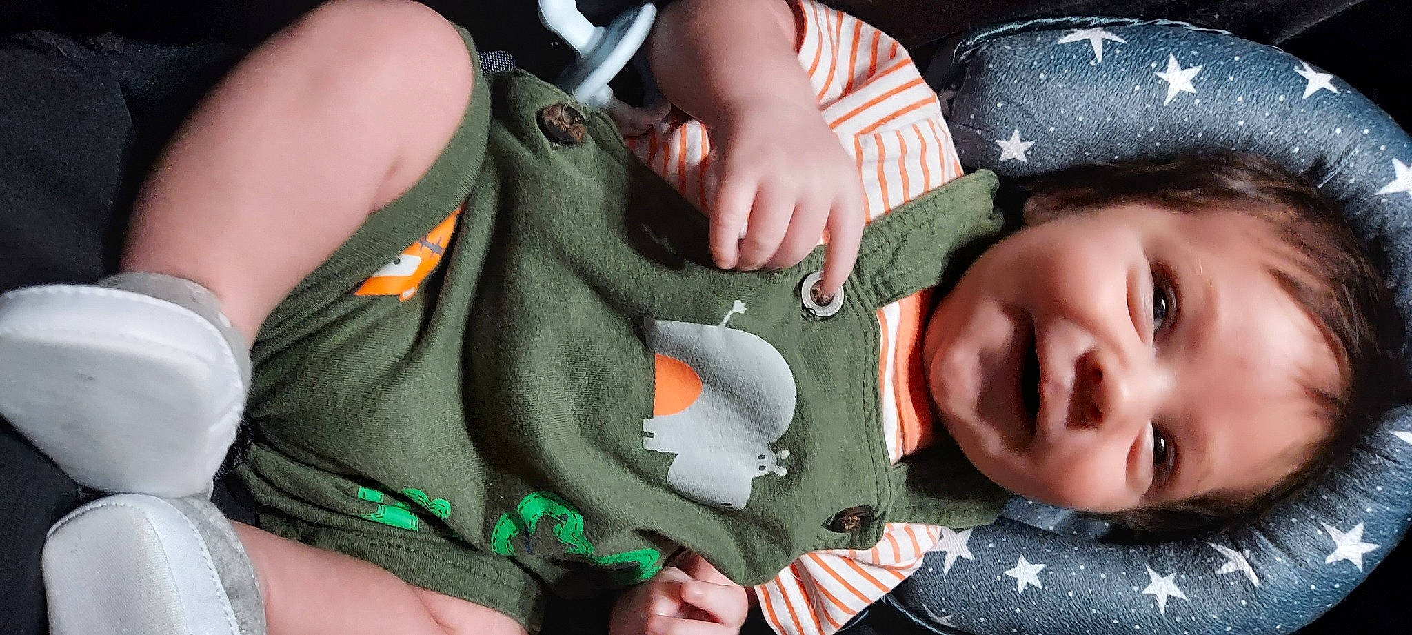 Archie is registered to the contest to win money with this photo: baby, baby_products, baby_toddler_clothing, cheek, child, close_up, comfort, finger, gesture, grass, green, hand, nail, person, product, skin, thumb, toddler, tree, vertebrate