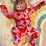 Kehlani is registered to the contest to win money with this photo: baby, pacifier, onesie, headband, bow, nike, pink, red, floral_pattern, infant, blanket, rainbow, numbers, lying_down, cute, child, sleepwear, footed_pajamas, portrait, indoors