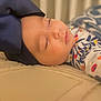 Kehlani joined the competition — help win amazing prizes! baby, sleeping, bow, headband, blanket, infant, face, closeup, patterned_clothing, peaceful, soft_lighting, indoors, cozy, child, portrait, resting, cute, young, head, toddler