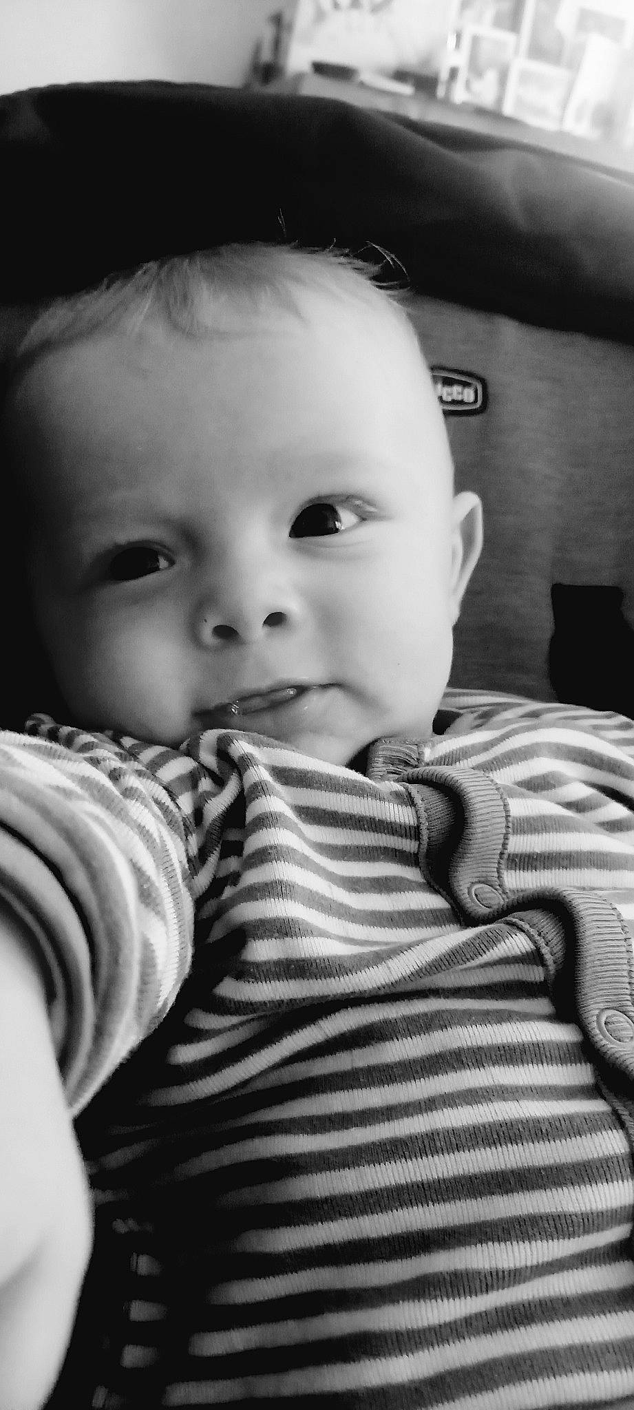 Nolan participe au concours pour gagner de l'argent avec cette photo : baby, baby_toddler_clothing, cheek, child, chin, comfort, eyebrow, eyelash, flash_photography, happy, iris, lip, monochrome, monochrome_photography, mouth, nose, person, sitting, skin, sleeve