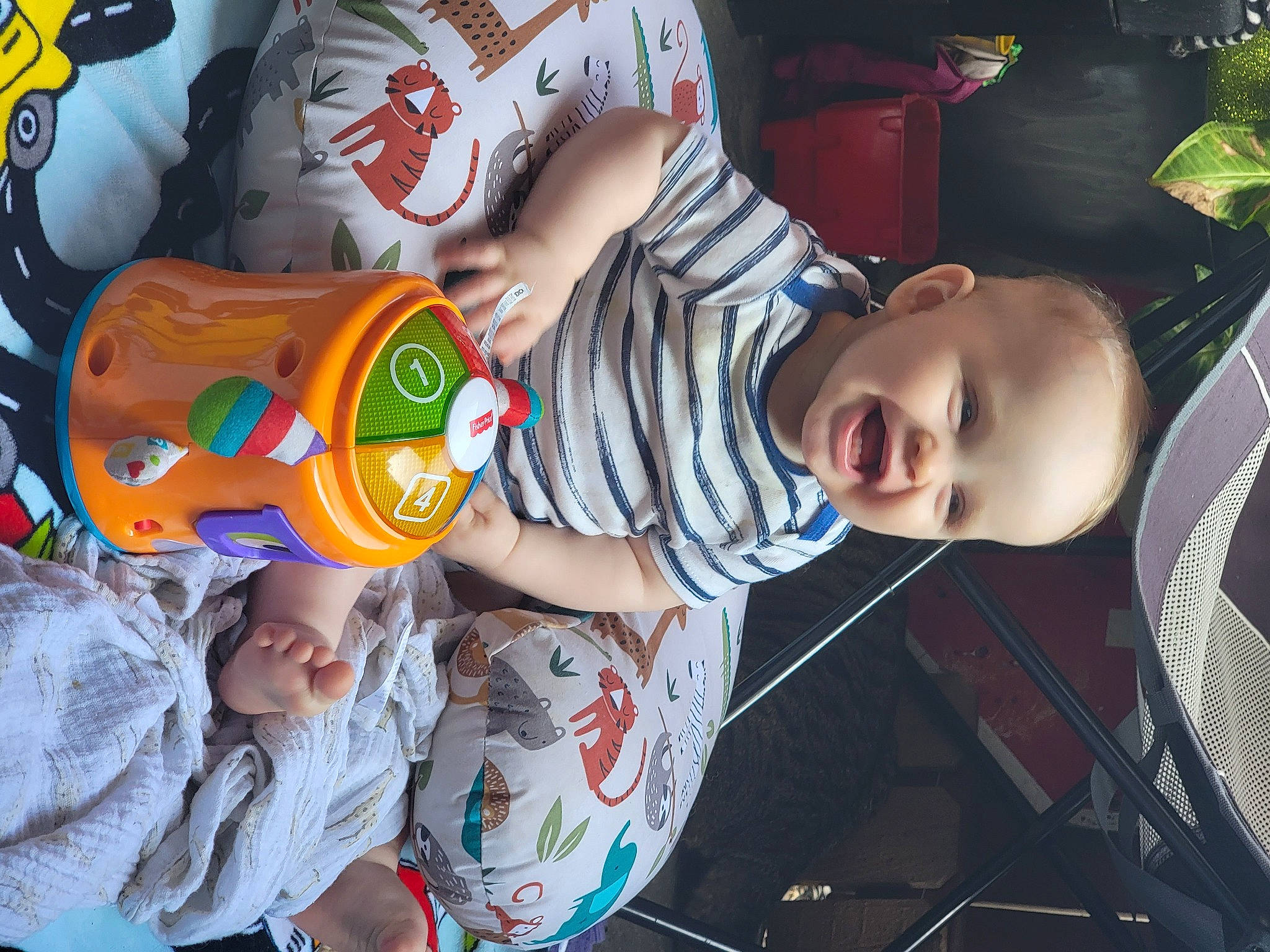 Henry is registered to the contest to win money with this photo: baby, baby_toddler_clothing, cheek, child, cool, facial_expression, finger, fun, hairstyle, happy, leisure, mouth, party_supply, person, plant, play, product, smile, t_shirt, toddler