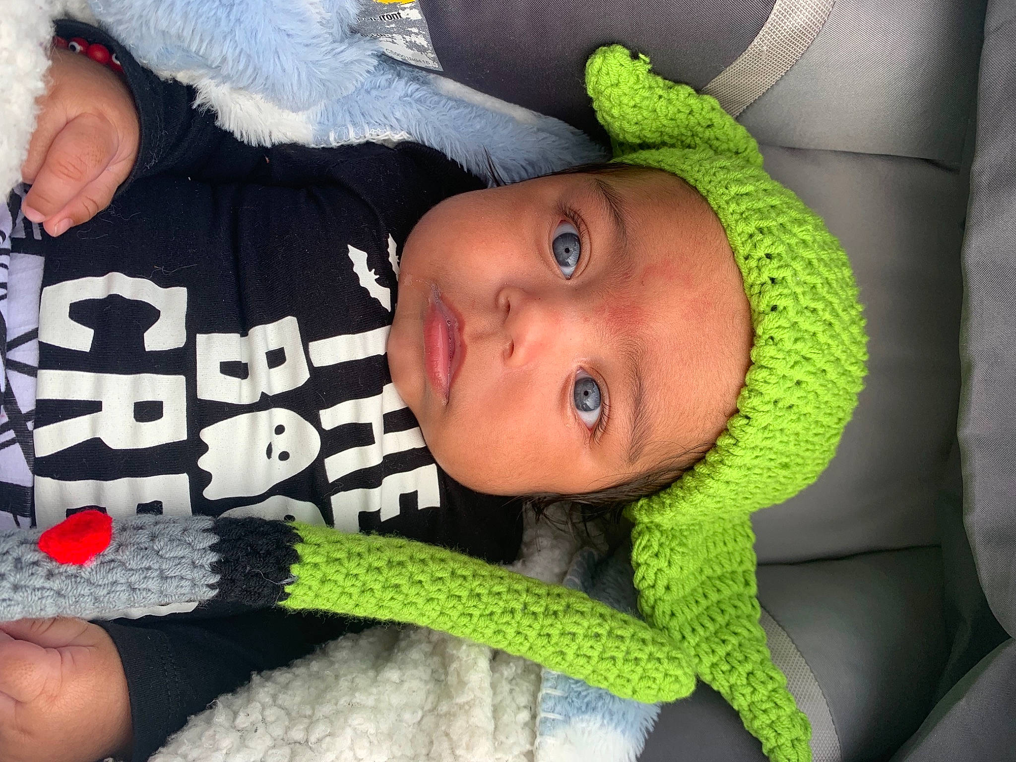 Kyro is registered to the contest to win money with this photo: arm, baby, baby_sleeping, baby_toddler_clothing, cap, cheek, child, cool, facial_expression, green, happy, headgear, headwear, lip, mouth, nose, organ, person, product, skin