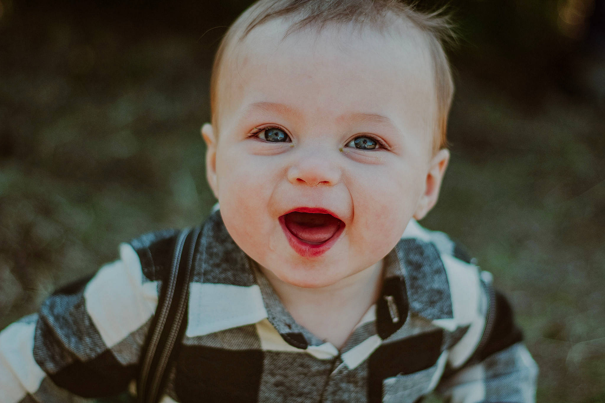 Braceson is registered to the contest to win money with this photo: baby, baby_toddler_clothing, cheek, child, flash_photography, grass, happy, human_body, lip, nose, outerwear, people_in_nature, person, plant, skin, sleeve, smile, toddler, tooth, tree