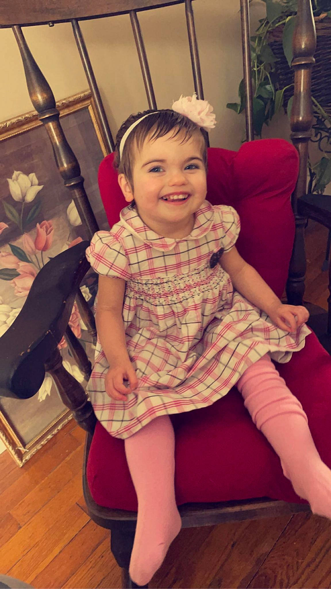 Irene Wheeler is registered to the contest to win money with this photo: chair, comfort, cool, facial_expression, furniture, hair, hairstyle, happy, head, joy, knee, lap, leg, person, pink, purple, shoe, shoulder, skin, smile