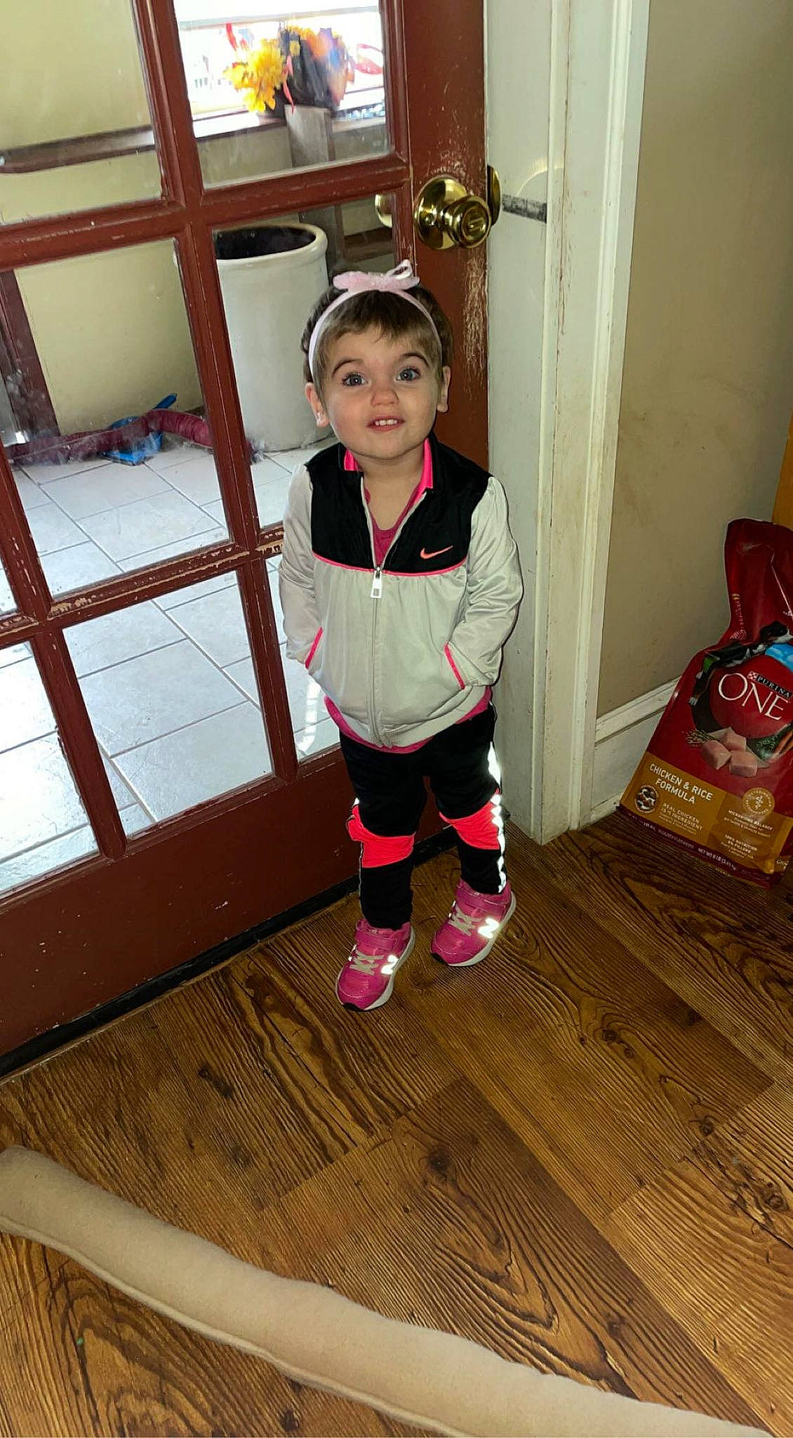 Irene Wheeler joined the competition — help win amazing prizes! baby_toddler_clothing, child, door, face, floor, flooring, hardwood, head, human_leg, laminate_flooring, magenta, person, room, sleeve, sock, thigh, toddler, varnish, wood, wood_flooring