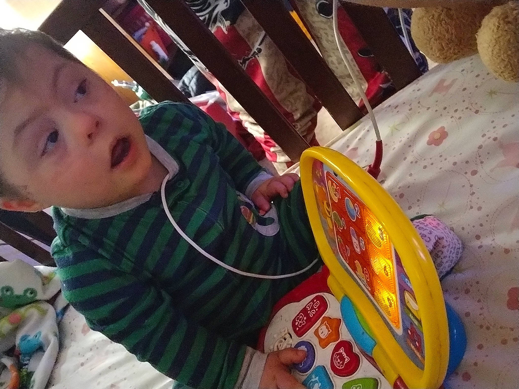 William is registered to the contest to win money with this photo: baby, chair, child, comfort_food, drum, fun, happy, hoodie, junk_food, leisure, person, play, room, snack, surprise, t_shirt, toddler, vacation