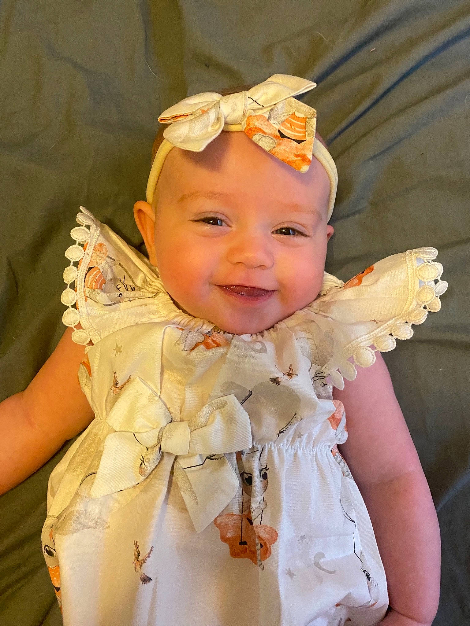 Kora is registered to the contest to win money with this photo: baby, baby_toddler_clothing, blond, bridal_accessory, crown, dress, embellishment, event, eye, fashion_design, hair_accessory, happy, head, headband, headpiece, headwear, iris, jewellery, joy, peach