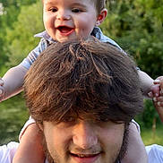Walker joined the competition — help win amazing prizes! baby, child, man, smile, happy, outdoor, nature, greenery, shoulders, portrait, face, hair, beard, dimple, foot, hand, holding, casual_clothing, daylight, family