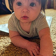 Oakylen is registered to the contest to win money with this photo: baby, carpet, child, clothing, crawling, curious, cute, eyes, face, floor, hair, hand, indoor, infant, light, natural_light, portrait, room, skin, striped_shirt