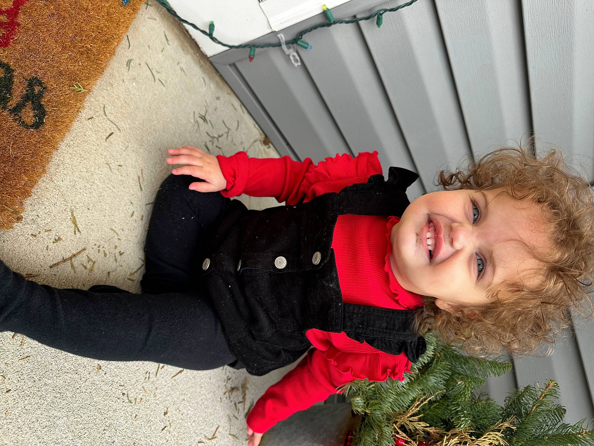 Giuliana is registered to the contest to win money with this photo: child, concrete, fun, grass, happy, laugh, leisure, people_in_nature, person, plant, portrait_photography, sitting, smile, toddler, travel, tree, vacation, winter