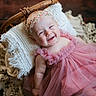 Eleanor is registered to the contest to win money with this photo: baby, infant, child, portrait, smiling, pink_dress, tutu, headband, floral, wicker_basket, blanket, cozy, indoor, studio, rustic, wooden_background, lying_down, happy, close_up, baby_photography