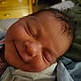 Lillian is registered to the contest to win money with this photo: baby, newborn, smiling, face, skin, infant, sleeping, closeup, indoors, fabric, blanket, clothing, head, peaceful, cute, human, portrait, resting, soft, warm