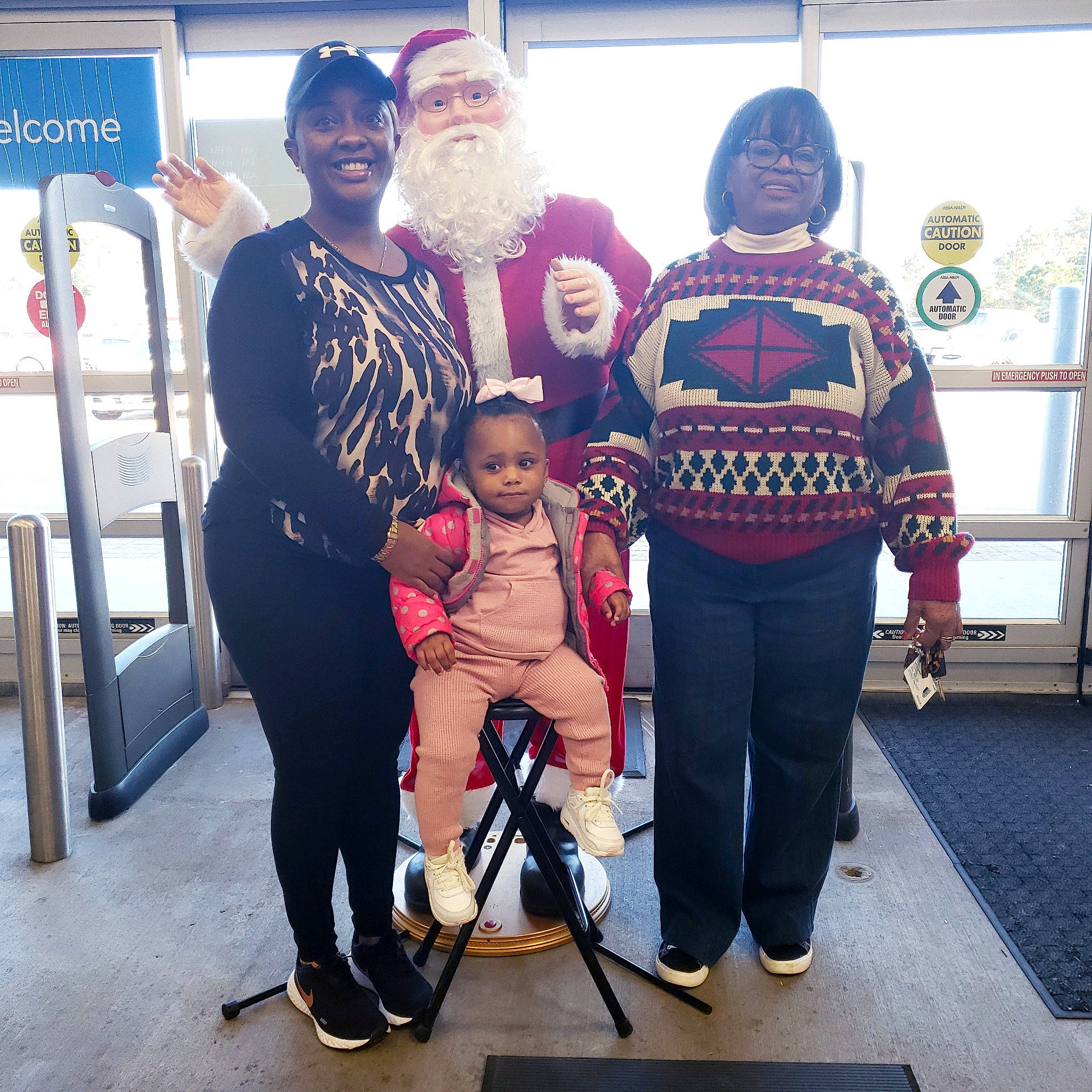 Phoenix is registered to the contest to win money with this photo: baby, beard, boot, chair, child, costume, event, fictional_character, fun, hat, holiday, joy, lap, person, recreation, santa_claus, smile, sunglasses, toddler, tradition