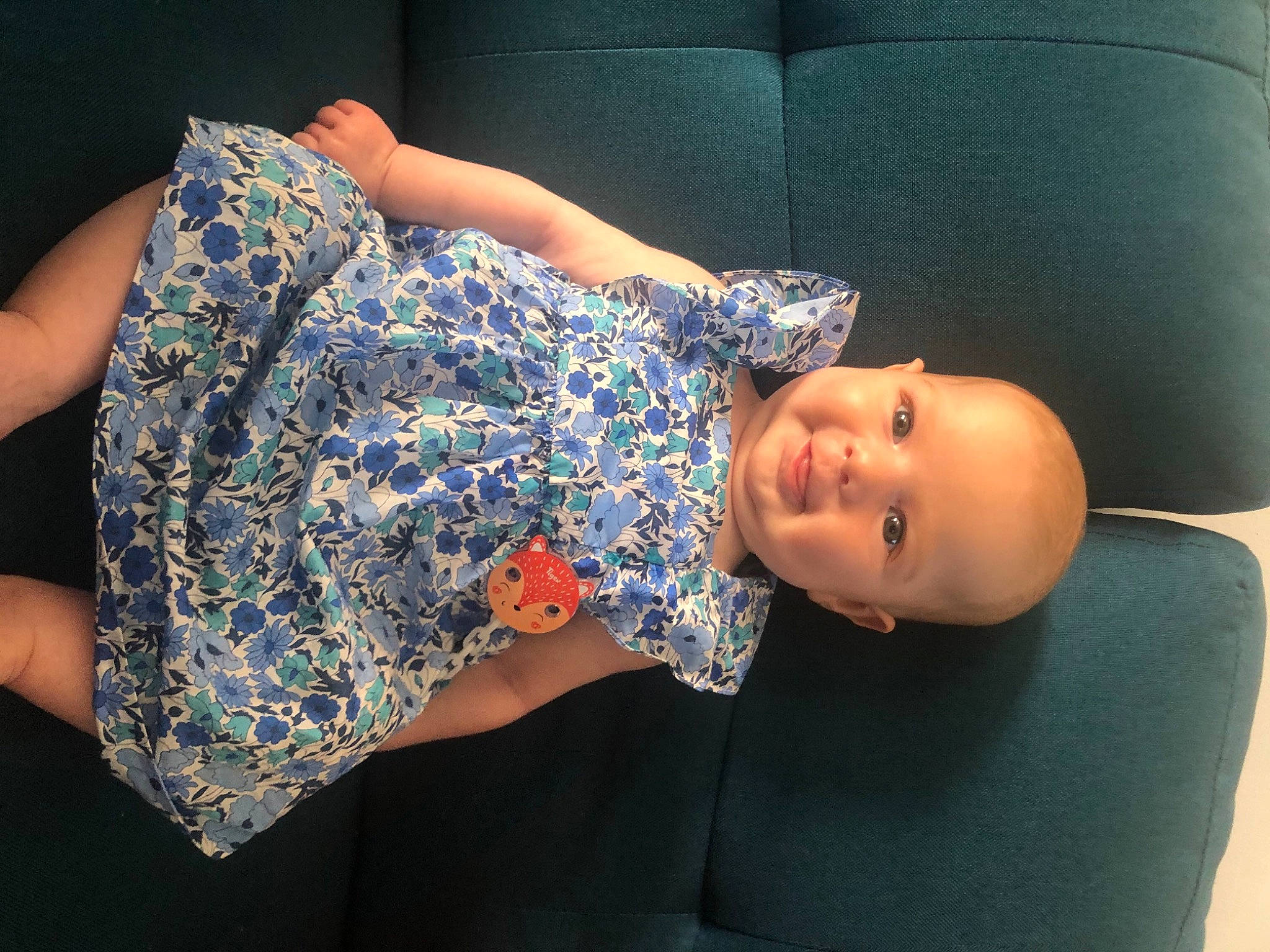 Lisa participe au concours pour gagner de l'argent avec cette photo : baby_toddler_clothing, comfort, couch, day_dress, dress, elbow, electric_blue, eye, fashion, finger, flash_photography, headgear, human_body, joint, joy, leg, neck, person, shoulder, thigh