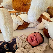 Thaïs participe au concours pour gagner de l'argent avec cette photo : baby, infant, smile, blanket, nursery, plush_toy, soft_toys, cushion, crib, clothing, sleeping_area, child, indoors, comfort, cute, fabric, star_pattern, happy, face, resting