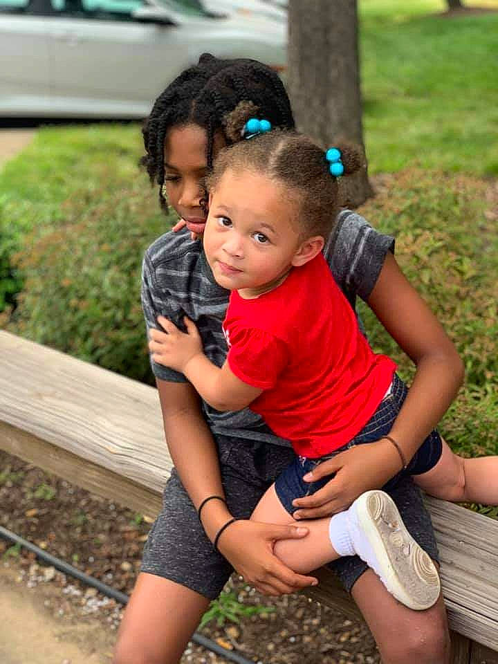 Isabella is registered to the contest to win money with this photo: baby, black_hair, child, fun, grass, happy, head, leg, leisure, mammal, people, people_in_nature, person, plant, shorts, smile, summer, t_shirt, thigh, toddler