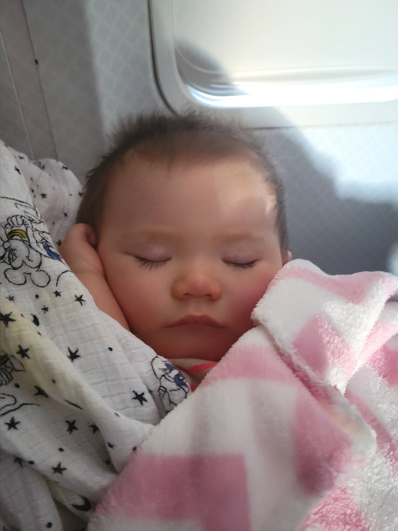 Erza is registered to the contest to win money with this photo: baby, baby_toddler_clothing, bedtime, cheek, child, chin, comfort, eye, eyelash, facial_expression, finger, linens, lip, nose, pattern, person, room, skin, sleeve, thumb