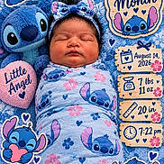 Elianna is registered to the contest to win money with this photo: newborn, baby, sleeping, portrait, swaddled, blanket, headband, stitch, plush_toy, disney, blue, pink, hearts, flowers, milestone, one_month, birth_announcement, indoor, lying_down, infant