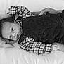 Victor a rejoint le concours — aidez-le/la à gagner de superbes lots ! baby, infant, black_and_white, portrait, clothing, plaid, overalls, hands, tattoo, lying_down, calm, closeup, newborn, person, face, expression, soft_light, gentle, resting, bed