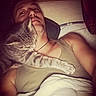 Tao participe au concours pour gagner de l'argent avec cette photo : man, cat, bed, pillow, blanket, sleeping, gray_tabby, indoor, affection, cozy, resting, human, pet, animal, comfort, tank_top, facial_hair, wood_wall, relaxing, night