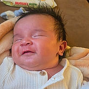 Max joined the competition — help win amazing prizes! baby, baby_wipes, blanket, buttoned_shirt, child, clothing, couch, cozy, face, hair, happy, indoor, infant, newborn, phone, portrait, resting, skin, smiling, soft