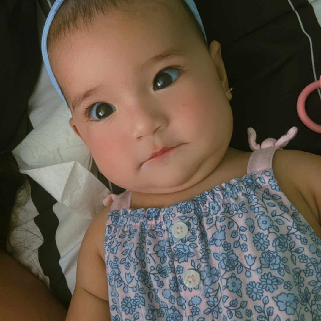 Ariadna joined the competition — help win amazing prizes! arm, baby, blanket, blue, child, closeup, cute, dress, earrings, eyes, face, floral_pattern, headband, indoors, innocent, lying_down, person, portrait, skin, striped